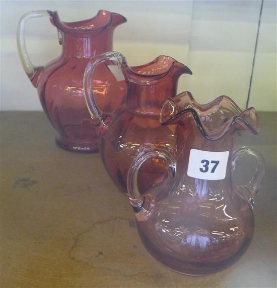 3 cranberry glass jugs